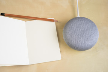 Ai speaker. Smart home device with note pad paper for making notes.