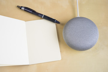 Ai speaker. Smart home device with note pad paper for making notes.