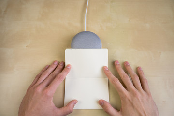Ai speaker. Smart home device with note pad paper for making notes.