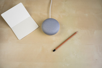 Ai speaker. Smart home device with note pad paper for making notes.
