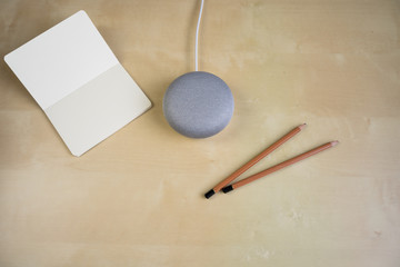 Ai speaker. Smart home device with note pad paper for making notes.