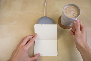 Ai speaker. Smart home device with note pad paper for making notes.