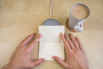 Ai speaker. Smart home device with note pad paper for making notes.