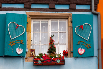Alsace. Facades of houses decorated for Christmas.