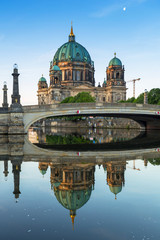 Fototapeta na wymiar Berlin Cathedral reflected in Spree River at dawn, Germany