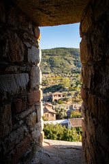 Houses appearing through stone window. At Sirince. 