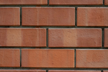 Obraz premium Red bricks wall with concrete marks pattern background macro