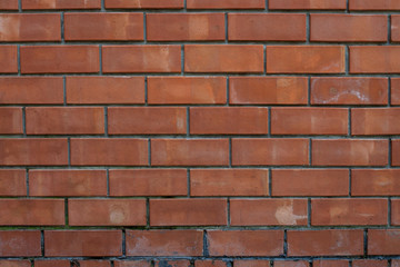Red bricks wall with concrete marks pattern background