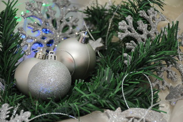 New Year's balls in silver color as a decoration on the Christmas tree