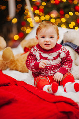 Happy fun child paying at home on Christmas time. Xmas holiday concept
