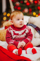 Happy fun child paying at home on Christmas time. Xmas holiday concept