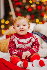 Happy fun child paying at home on Christmas time. Xmas holiday concept