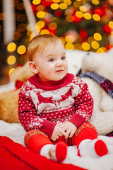 Happy fun child paying at home on Christmas time. Xmas holiday concept
