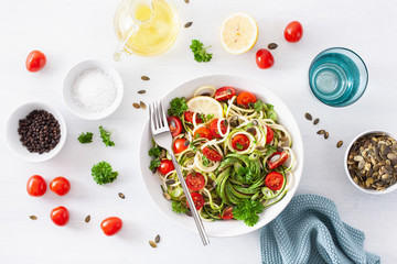 vegan ketogenic spiralized courgette salad with avocado tomato pumpkin seeds