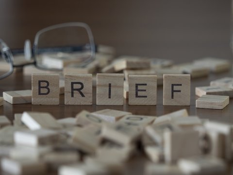 The concept of Brief represented by wooden letter tiles