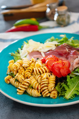 tasty pasta with roast ham on the table