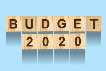 Budget 2020, the inscription on the wooden blocks, on a blue background. Isolated.New Year Budget Concept. Business.