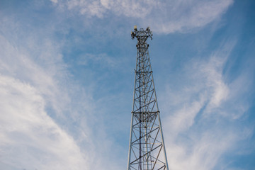 Telecommunication pole against the beautiful sky.copy space right