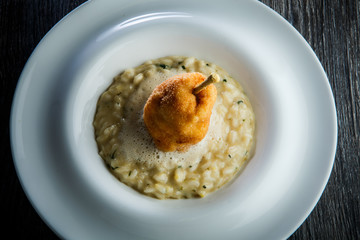 top view closeup boiled barley porridge with breaded whole pear