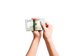 Top view of female hands counting dollar banknotes on white isolated background. Investment and...
