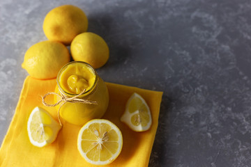 Homemade lemon curd in a jar, made from eggs, lemon, honey and butter.