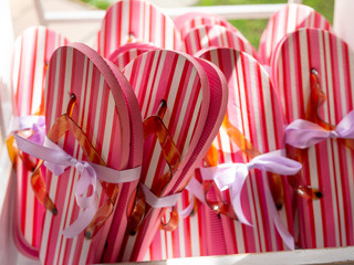 bunch of colorful flip flops tied up with ribbons