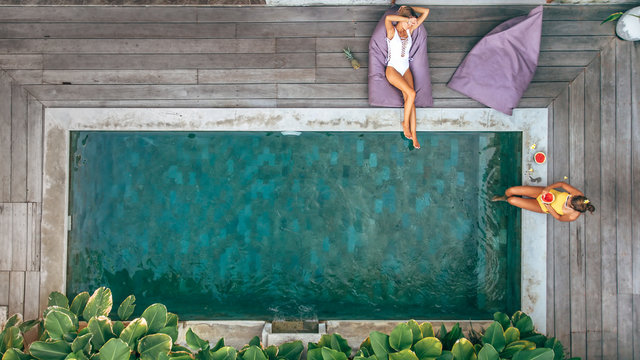 People relaxing in pool on Bali villa