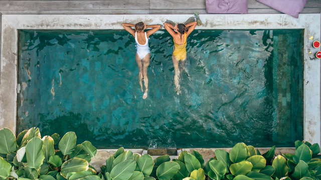 People relaxing in pool on Bali villa