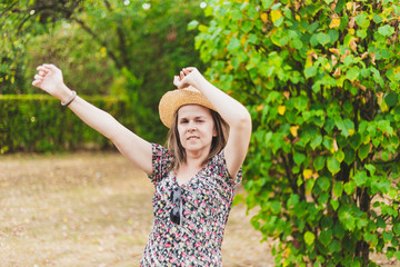 Woman waving goodbye outdoors