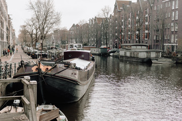 boats in canal amsterdam