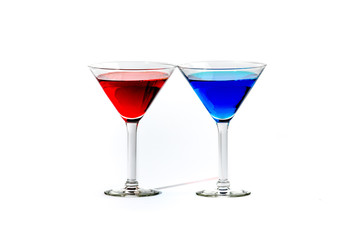 martini glasses with colorful cocktails isolated on white