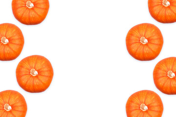 Top view of ripe orange pumpkins isolated on white background. Thanksgiving and Heloween concept. Pattern. Copy space.