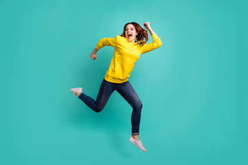 Fototapeta na wymiar Full length body size photo of crazy charming nice attractive cute ecstatic overjoyed girl wearing jeans denim running towards future on foot isolated over teal vivid color background
