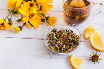 Herbal natural hot tea with different herbs,lemon and honey. Vitamins, healthy lifestyle concept
