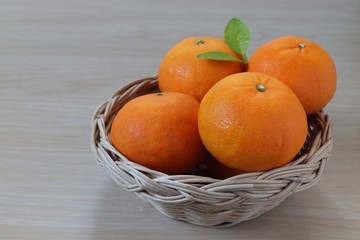 Oranges , fruit in a tray on wooden background