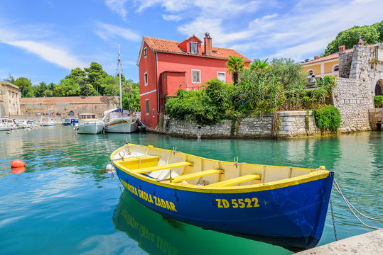 ZADAR, CROATIA - JULY 14, 2017: Pleasure boats and fishing boats on the pier in Fosa Bay in the spa town of Zadar in Croatia.