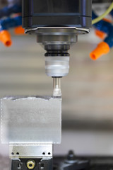 High precision CNC machining center working, operator machining automotive sample part process in the factory