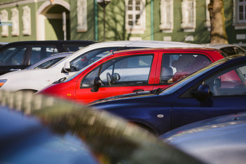 View of tightly packed cars in parking lot
