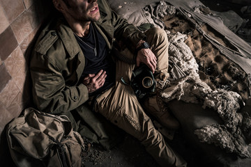 Fototapeta premium cropped view of man with dirty face suffering pain, post apocalyptic concept