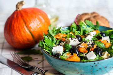 green salad with feta cheese olives pumpkin