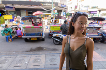 Tourist woman exploring the city of Bangkok at Khao San Road