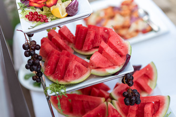 Watermelon on a white dish. Buffet, fruits