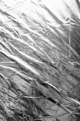 Crumpled silver material as abstract background