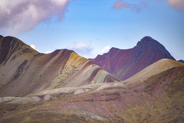 Views of the Vinicuna 'rainbow mountain' from a distance. Cordillera Vilcanota, Cusco, Peru