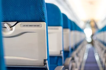 Photo sur Aluminium Avion Safety message on passenger seats of the airplane