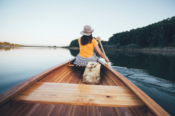 Woman paddling canoe