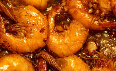 Shrimp fried in a pan in oil