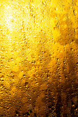 A foggy window at sunset as an abstract background