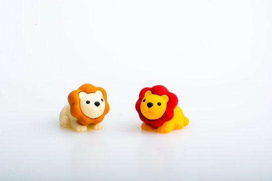 Two lion rubber toys, cute animal shaped rubber doll isolated in white background. 