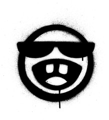 graffiti sprayed icon with sunglasses laughing out loud